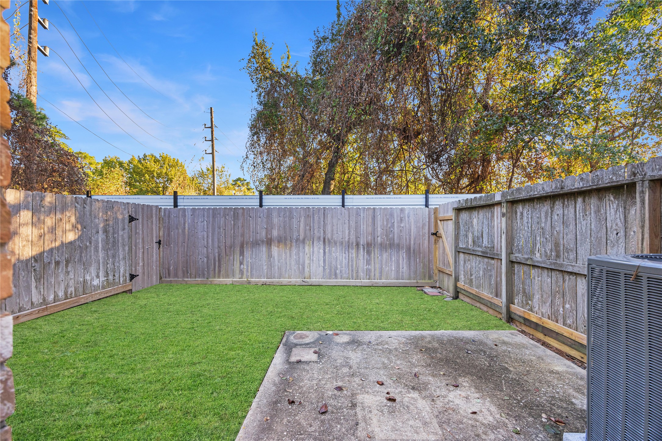 12755 Mill Ridge Drive, Unit 703 Cypress, TX 77429 - Photo 20 of 31 a view of backyard with wooden fence