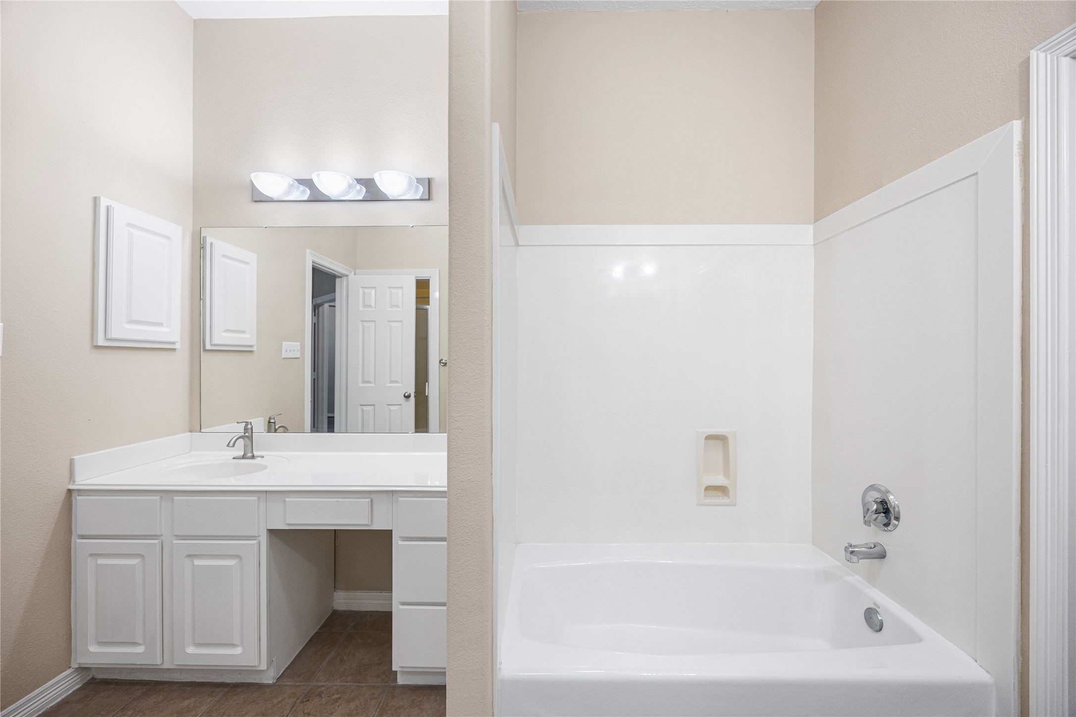 12755 Mill Ridge Drive, Unit 703 Cypress, TX 77429 - Photo 22 of 31 a bathroom with a sink and a mirror