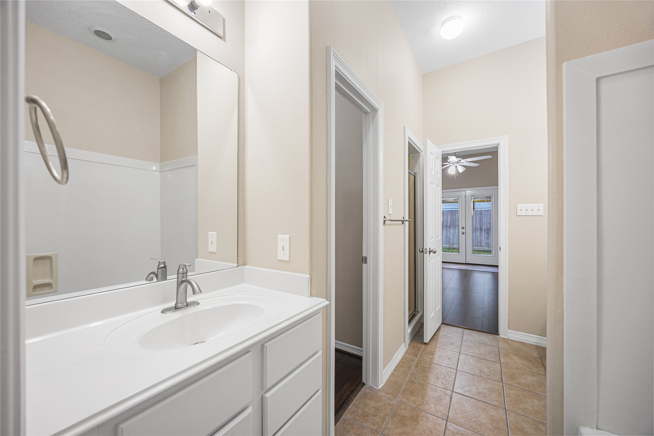 12755 Mill Ridge Drive, Unit 703 Cypress, TX 77429 - Photo 23 of 31 a bathroom with a sink and a mirror