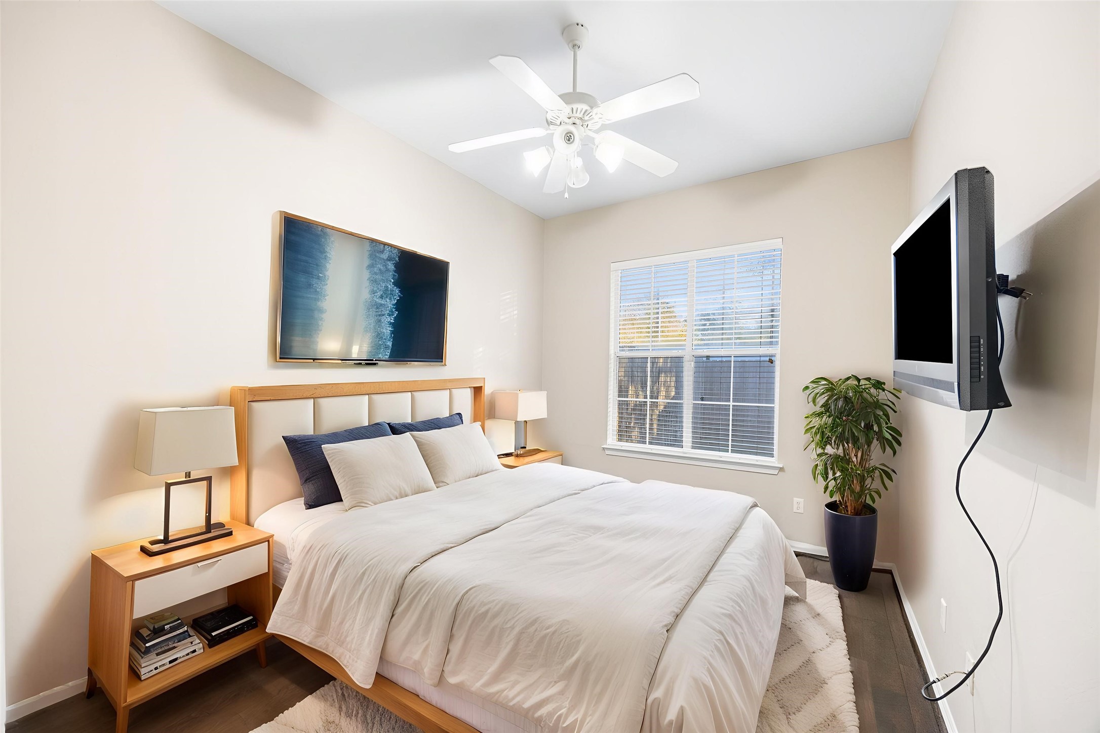 12755 Mill Ridge Drive, Unit 703 Cypress, TX 77429 - Photo 24 of 31 a bedroom with a bed and a flat screen tv