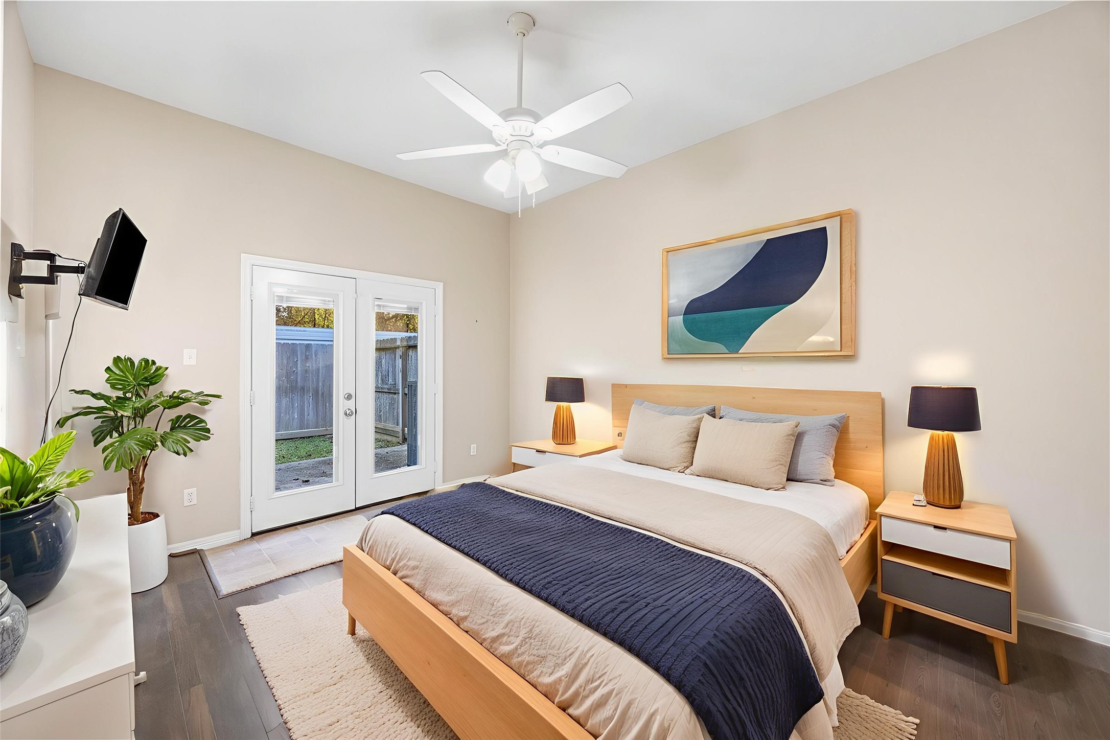 12755 Mill Ridge Drive, Unit 703 Cypress, TX 77429 - Photo 3 of 31 a bedroom with a bed and a potted plant