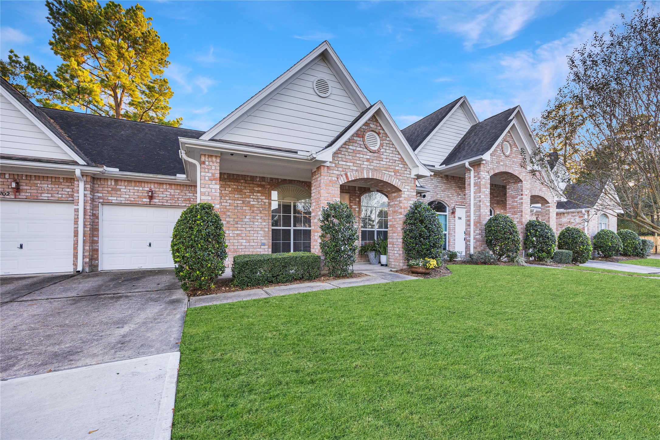 12755 Mill Ridge Drive, Unit 703 Cypress, TX 77429 - Photo 31 of 31 a front view of a house with a yard and garage