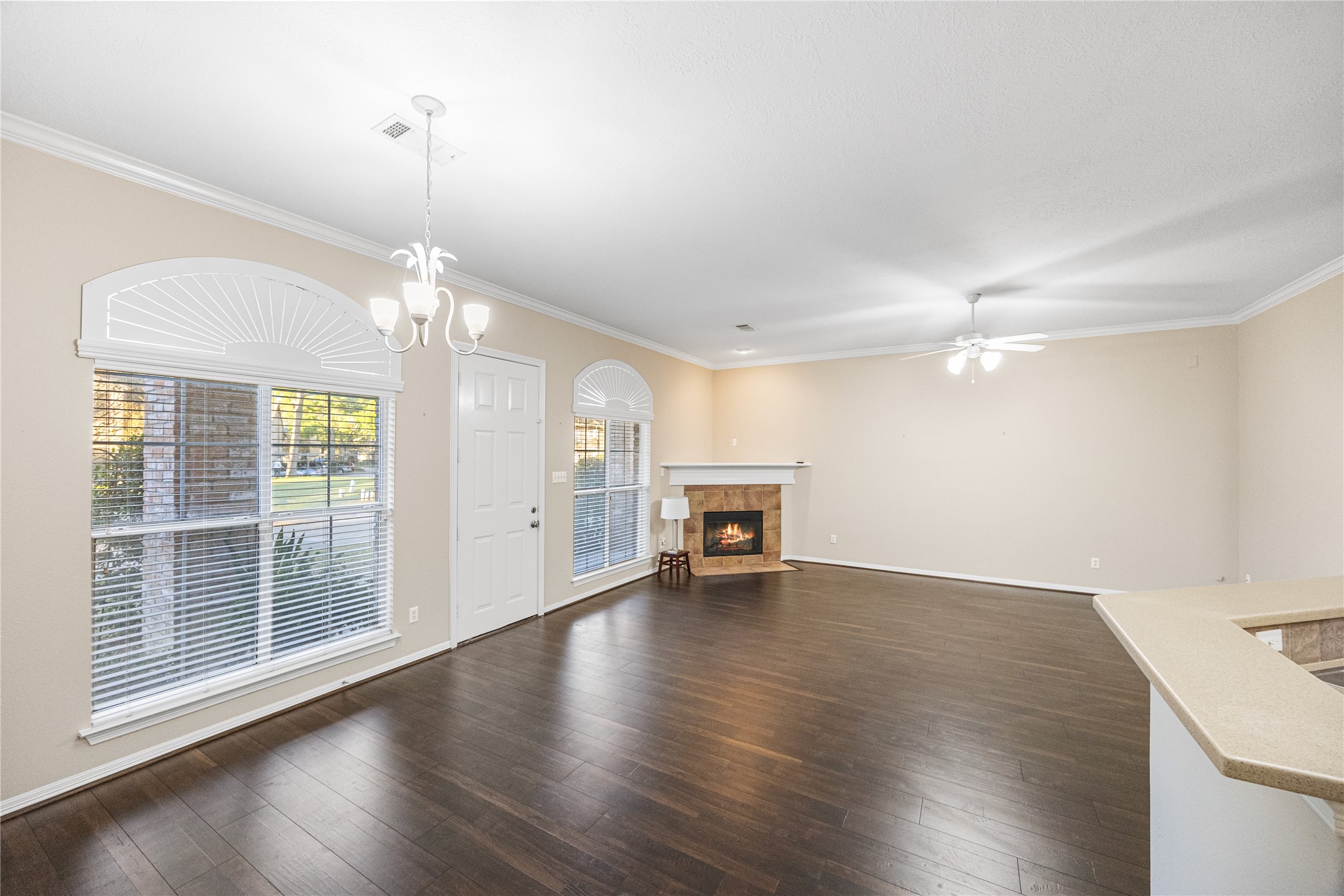 12755 Mill Ridge Drive, Unit 703 Cypress, TX 77429 - Photo 8 of 31 a view of an empty room with wooden floor fireplace and a window