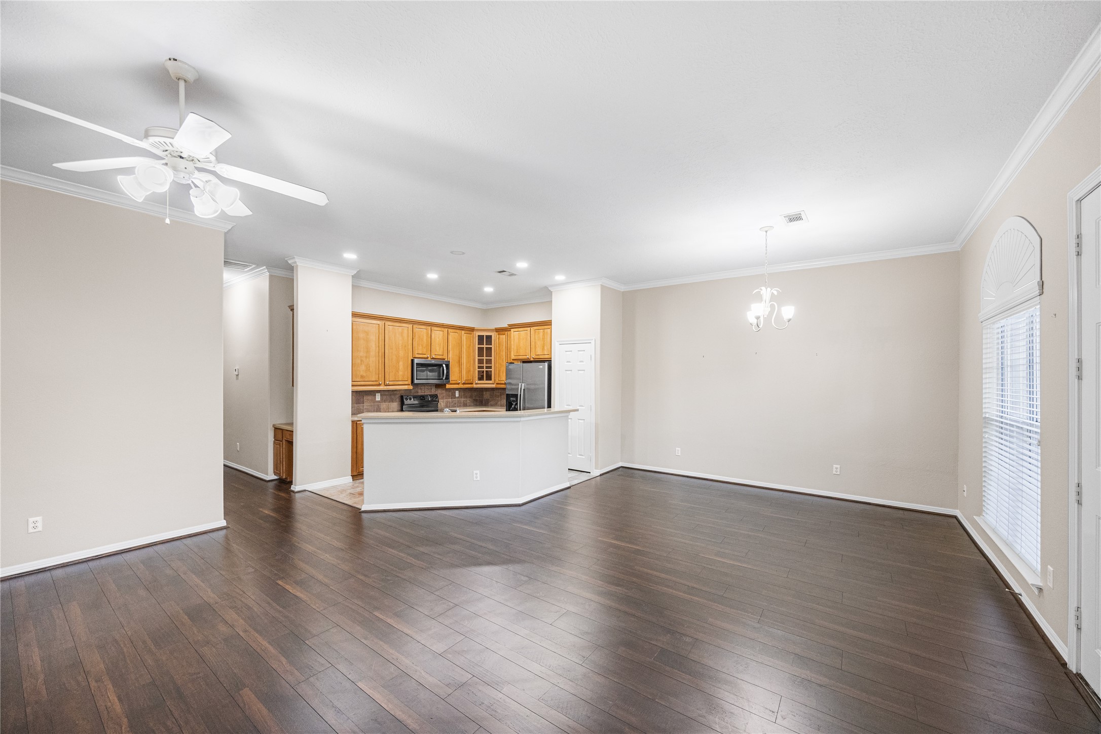 12755 Mill Ridge Drive, Unit 703 Cypress, TX 77429 - Photo 10 of 31 a view of empty room with wooden floor