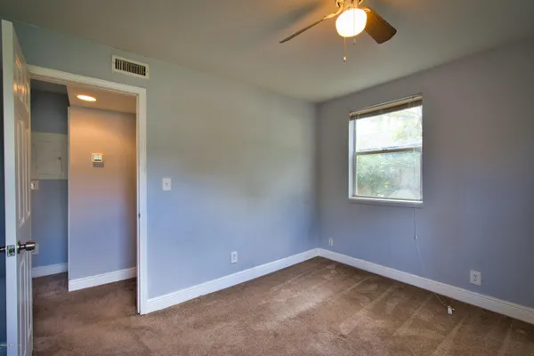 an empty room with a empty space and a window