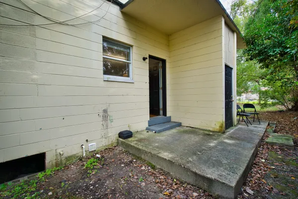 a view of a backyard of the house