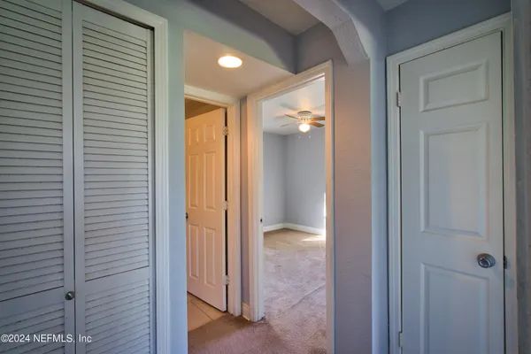 a view of a bathroom from a hallway