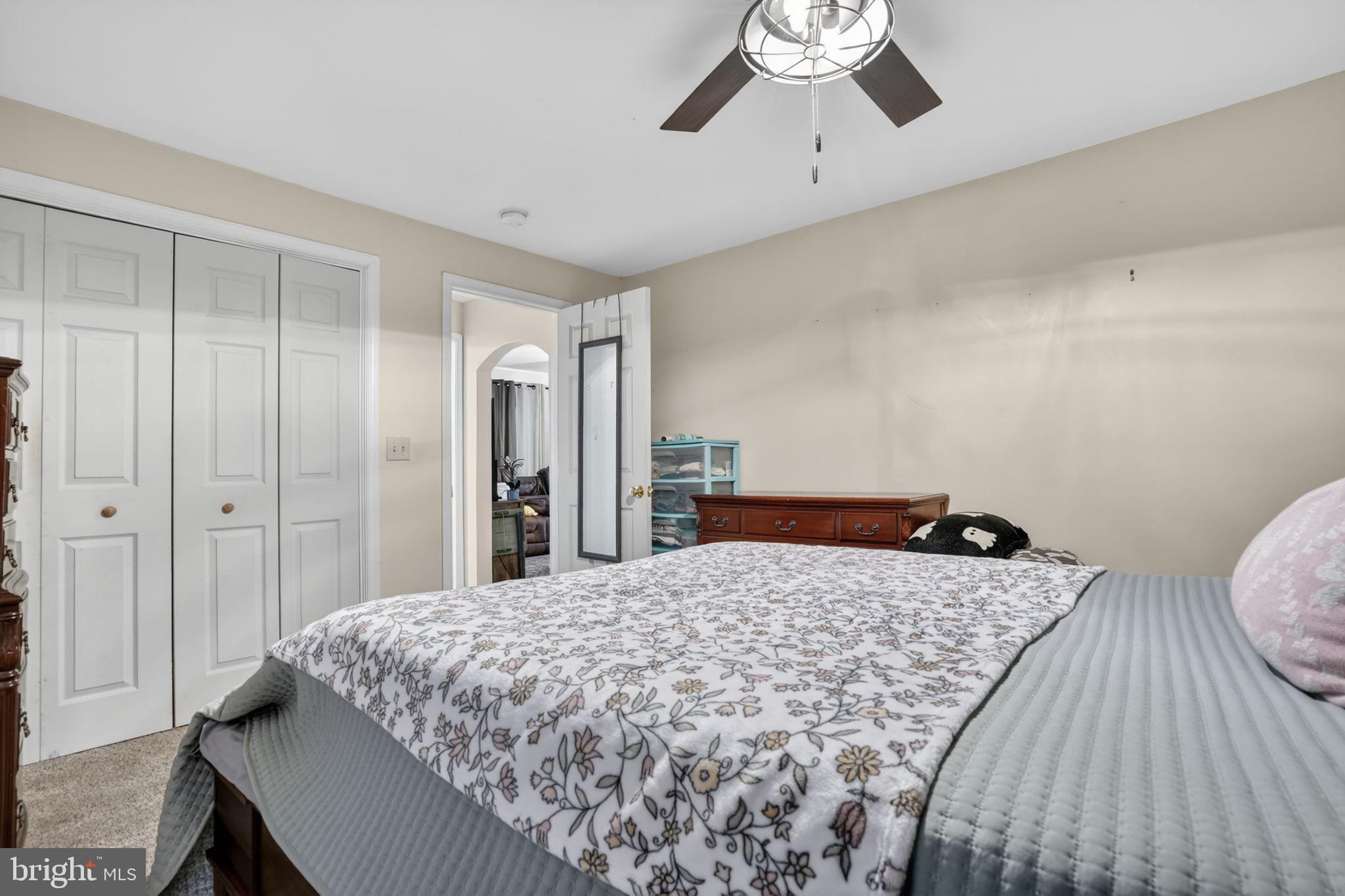 7278 Fleming Road New Church, VA 23415 - Photo 20 of 44 a bedroom with a bed and a dresser