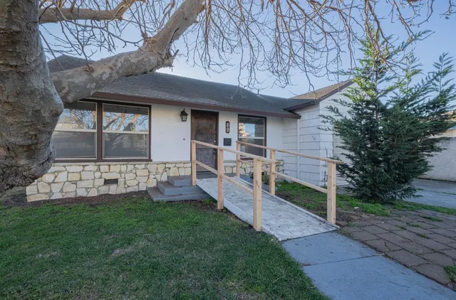 a front view of a house with a yard