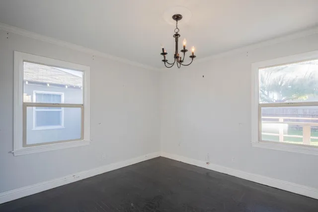 an empty room with windows