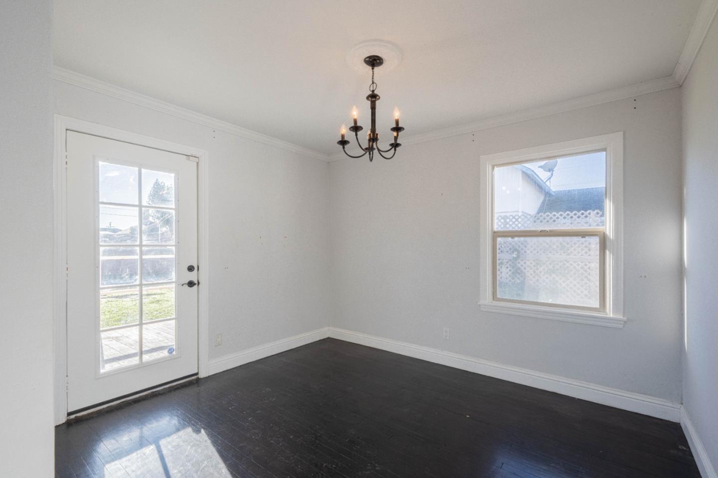 89 Clark Street Salinas, CA 93901 - Photo 18 of 35 an empty room with wooden floor windows and closet