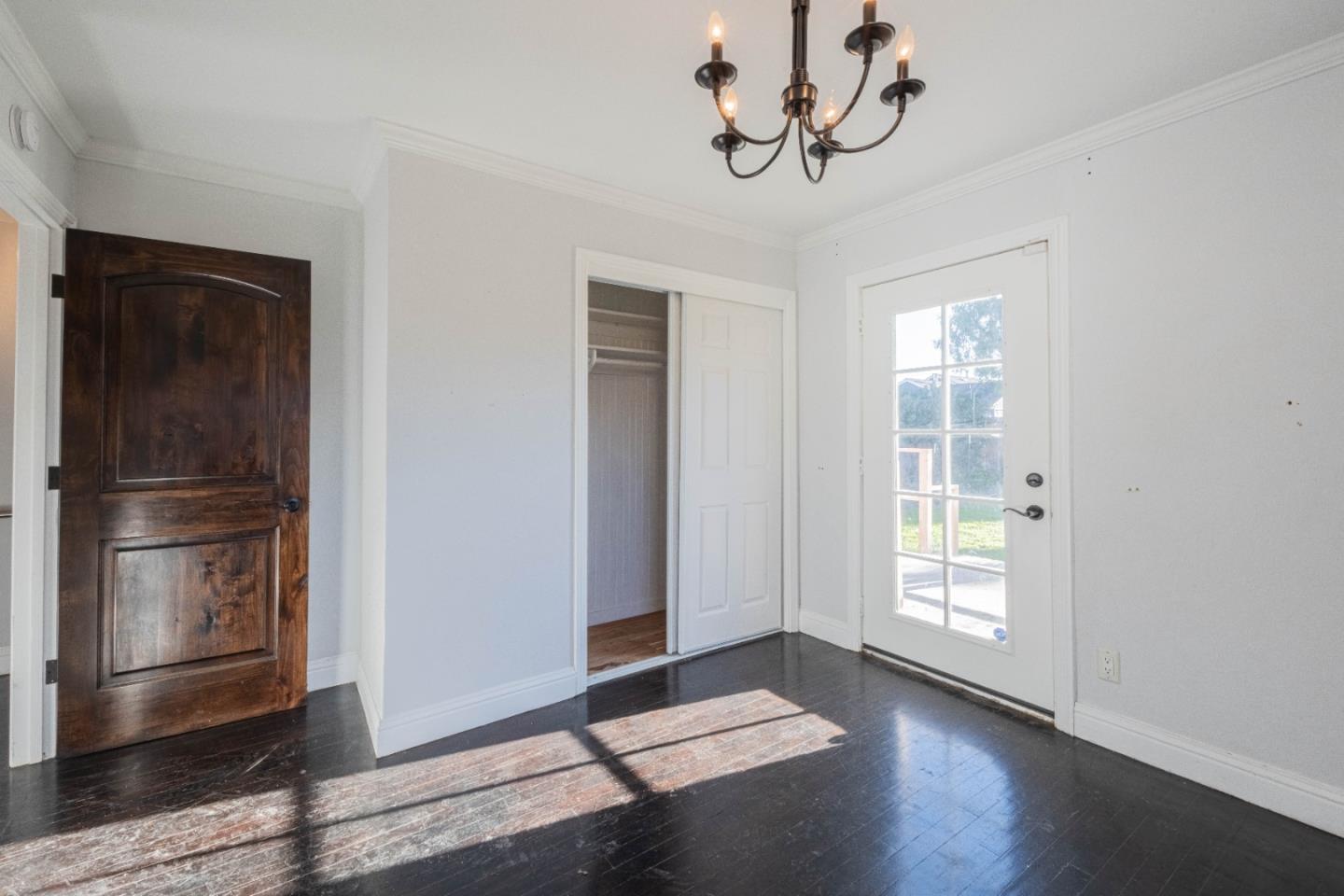 89 Clark Street Salinas, CA 93901 - Photo 20 of 35 a view of empty room with wooden floor and window