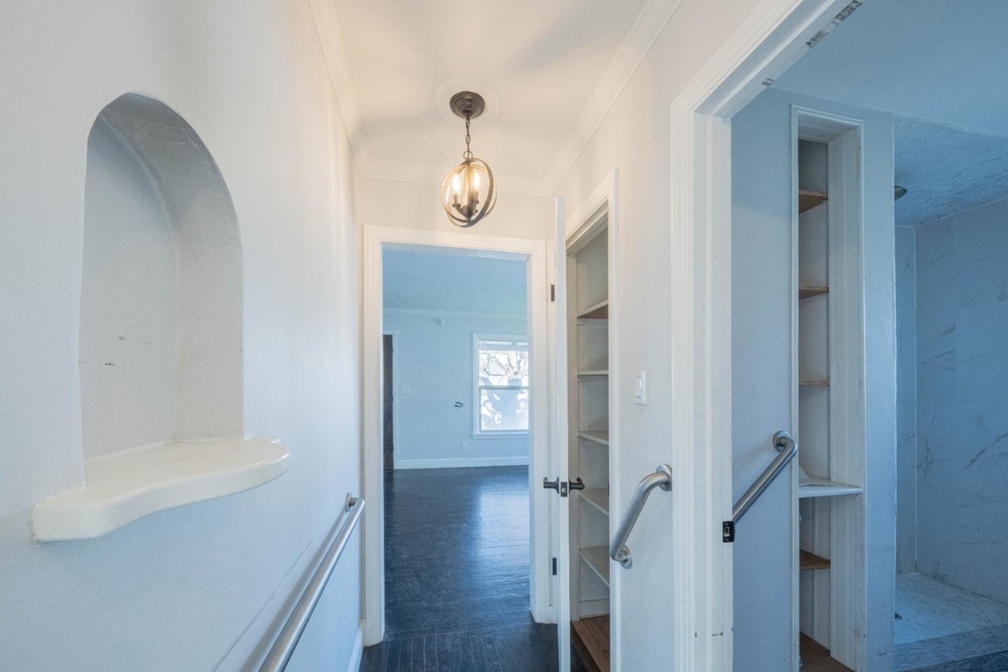 89 Clark Street Salinas, CA 93901 - Photo 27 of 35 a view of a hallway with wooden floor and staircase