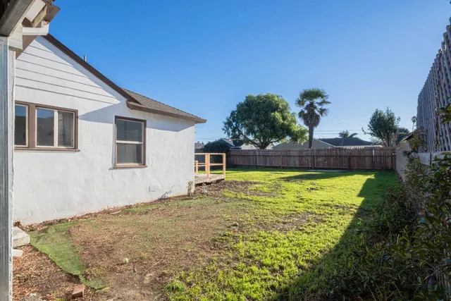 a bathroom with a tub and trees in the background