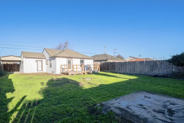 a swimming pool with wooden fence
