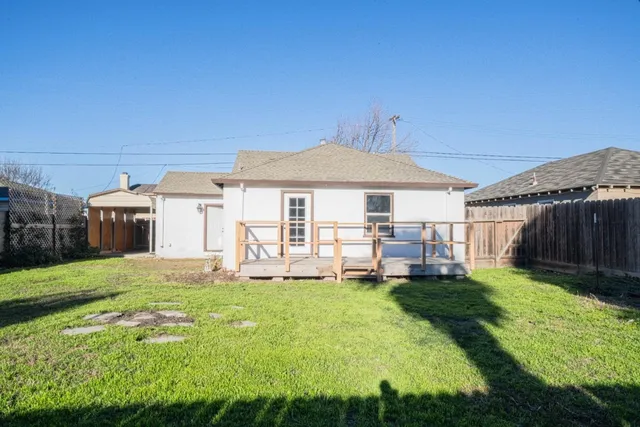 a house view with a sitting space and garden