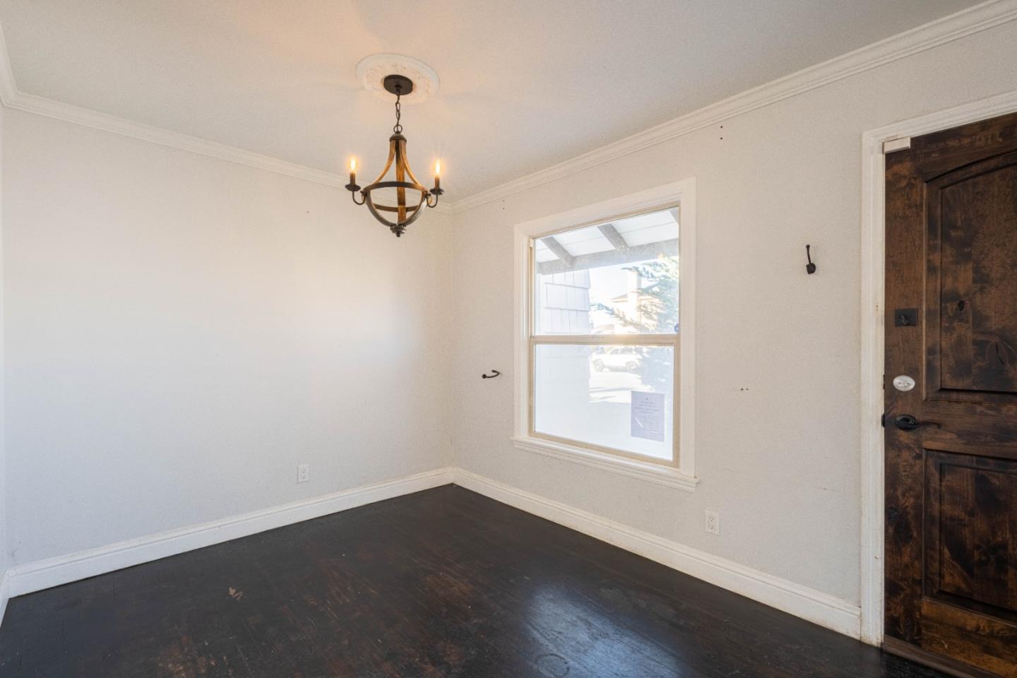 89 Clark Street Salinas, CA 93901 - Photo 9 of 35 an empty room with wooden floor and windows