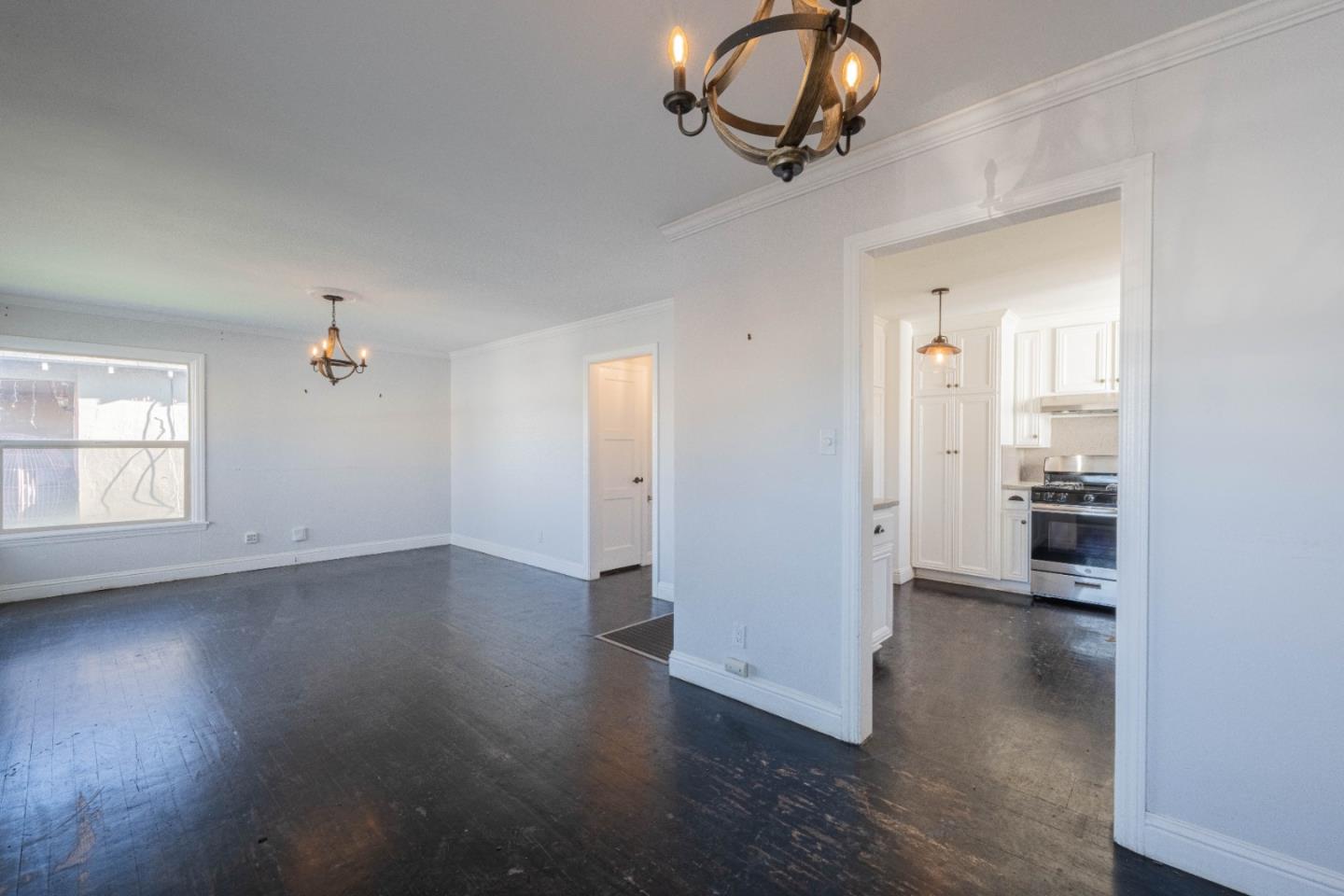 89 Clark Street Salinas, CA 93901 - Photo 10 of 35 an empty room with wooden floor and windows
