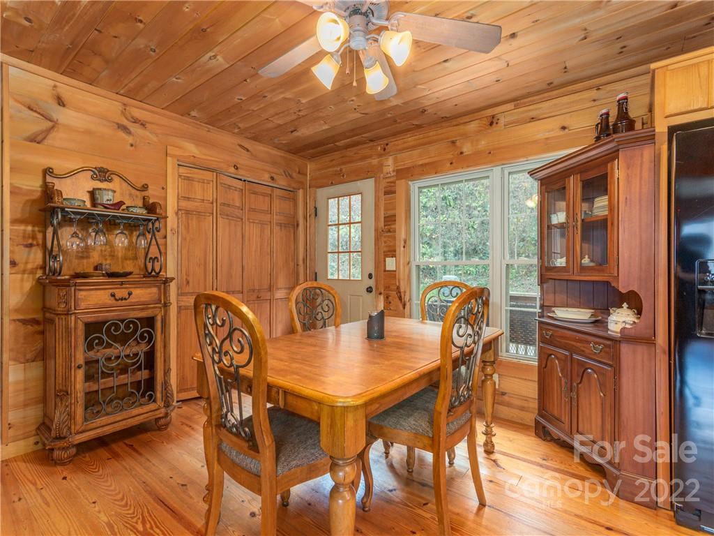 839 Price Town Road Clyde, NC 28721 - Photo 14 of 27 a view of a dining room with furniture window and outside view