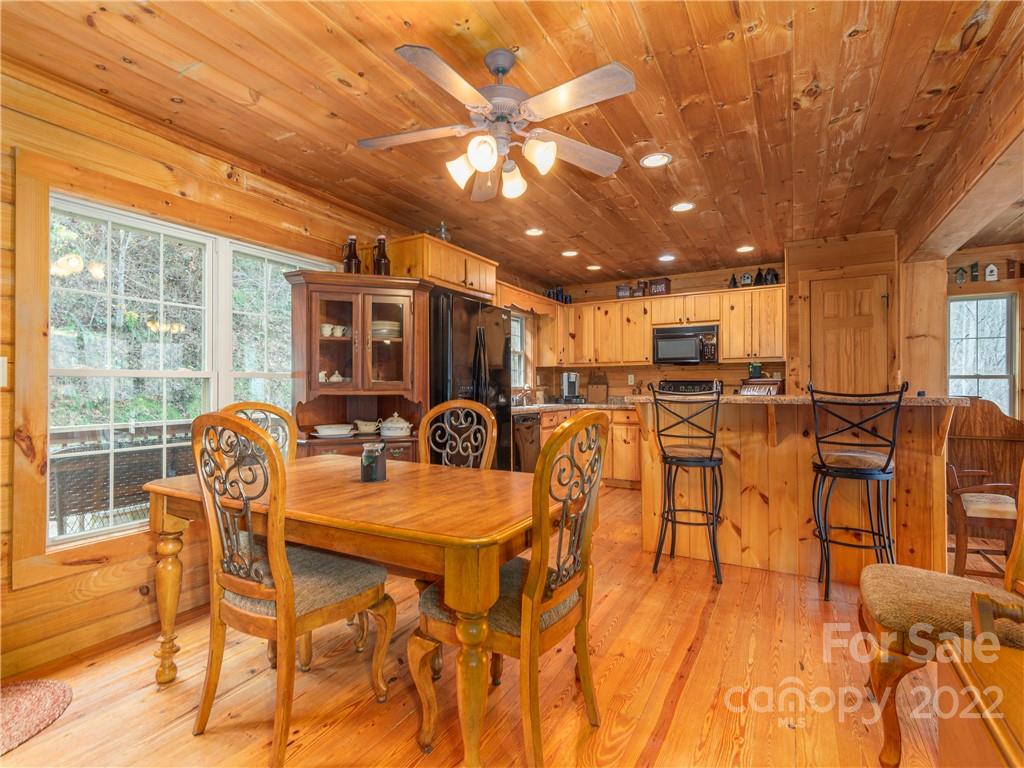 839 Price Town Road Clyde, NC 28721 - Photo 15 of 27 a view of a dining room with furniture window and outside view