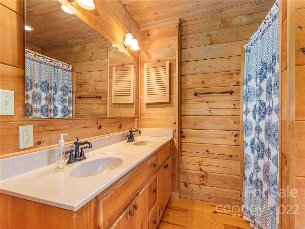 839 Price Town Road Clyde, NC 28721 - Photo 17 of 27 a bathroom with a sink and a mirror