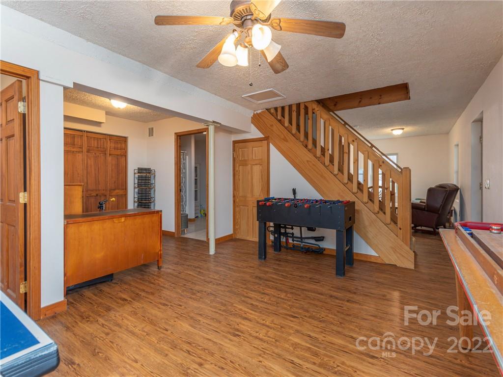 839 Price Town Road Clyde, NC 28721 - Photo 21 of 27 a view of entryway and hall with wooden floor