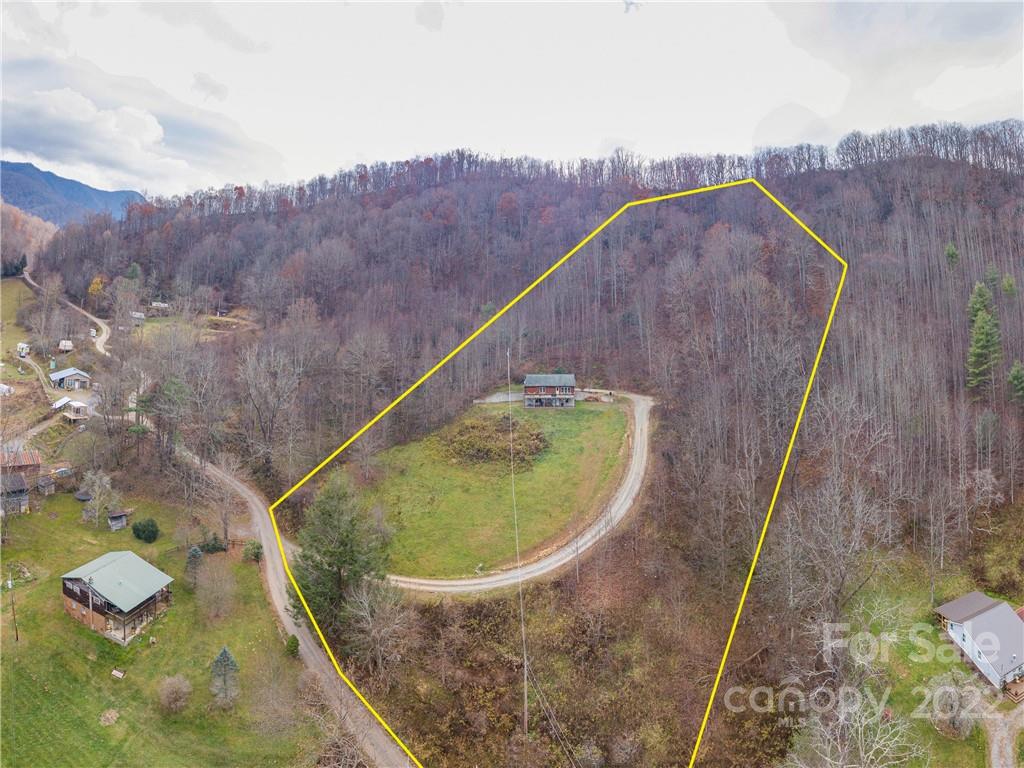 839 Price Town Road Clyde, NC 28721 - Photo 27 of 27 a view of a swimming pool with a yard