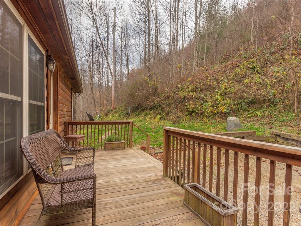 839 Price Town Road Clyde, NC 28721 - Photo 4 of 27 a view of a balcony with wooden floor