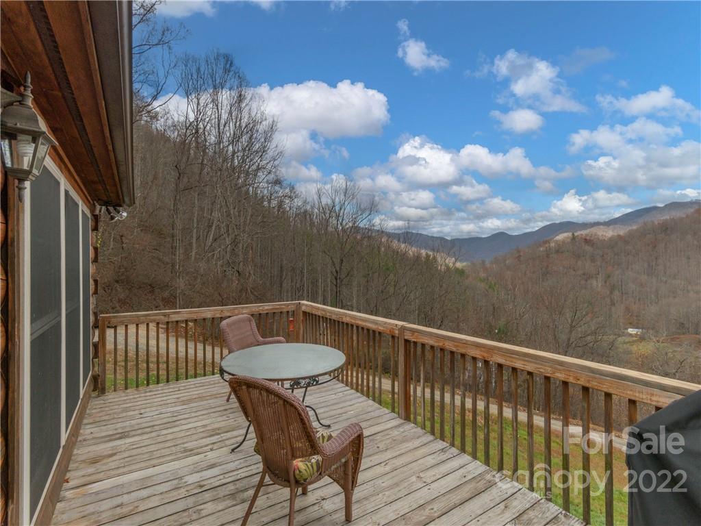 839 Price Town Road Clyde, NC 28721 - Photo 6 of 27 a view of a balcony with wooden floor
