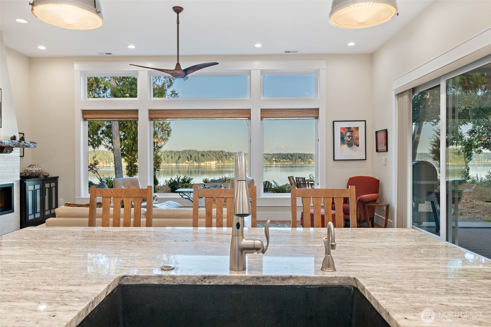 211 East Vineyard Crest Road Grapeview, WA 98546 - Photo 18 of 40 a dining room with wooden floor and furniture