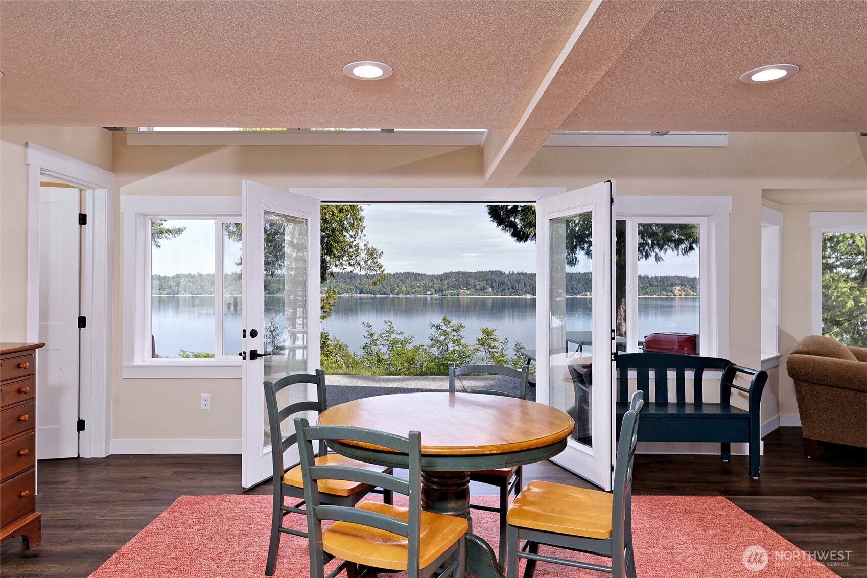 211 East Vineyard Crest Road Grapeview, WA 98546 - Photo 35 of 40 a view of a dining room with furniture window and wooden floor