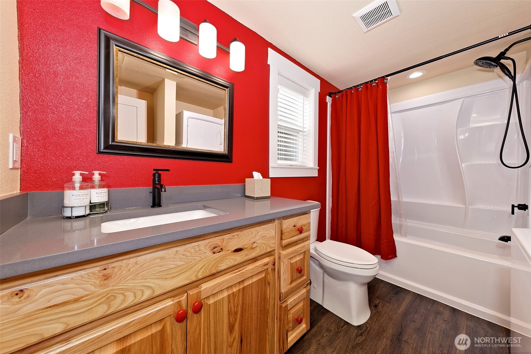 211 East Vineyard Crest Road Grapeview, WA 98546 - Photo 37 of 40 a bathroom with a bathtub sink vanity mirror and toilet