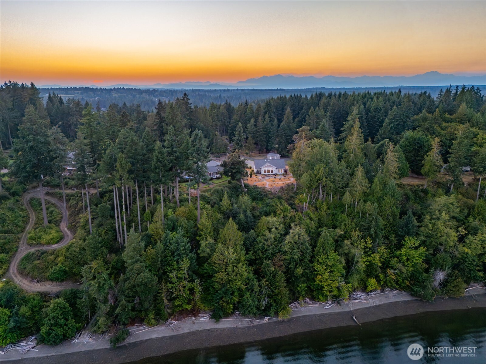 211 East Vineyard Crest Road Grapeview, WA 98546 - Photo 6 of 40 a view of a city with lush green forest