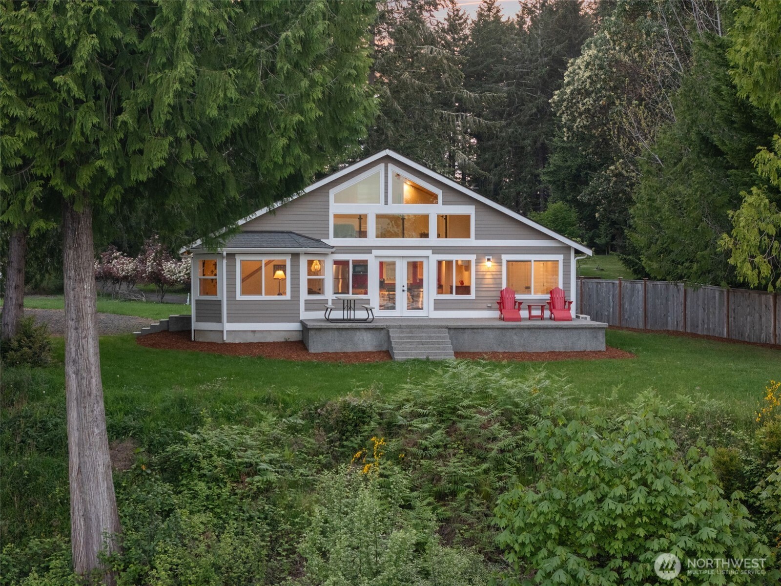 211 East Vineyard Crest Road Grapeview, WA 98546 - Photo 10 of 40 a front view of a house with garden