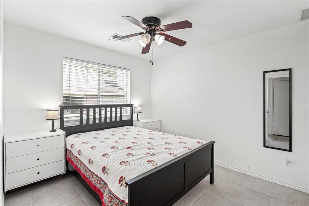 1011 Ridgecrest Drive McKinney, TX 75069 - Photo 24 of 31 Bedroom featuring a window with blinds, a ceiling fan with integrated lighting, and tile flooring