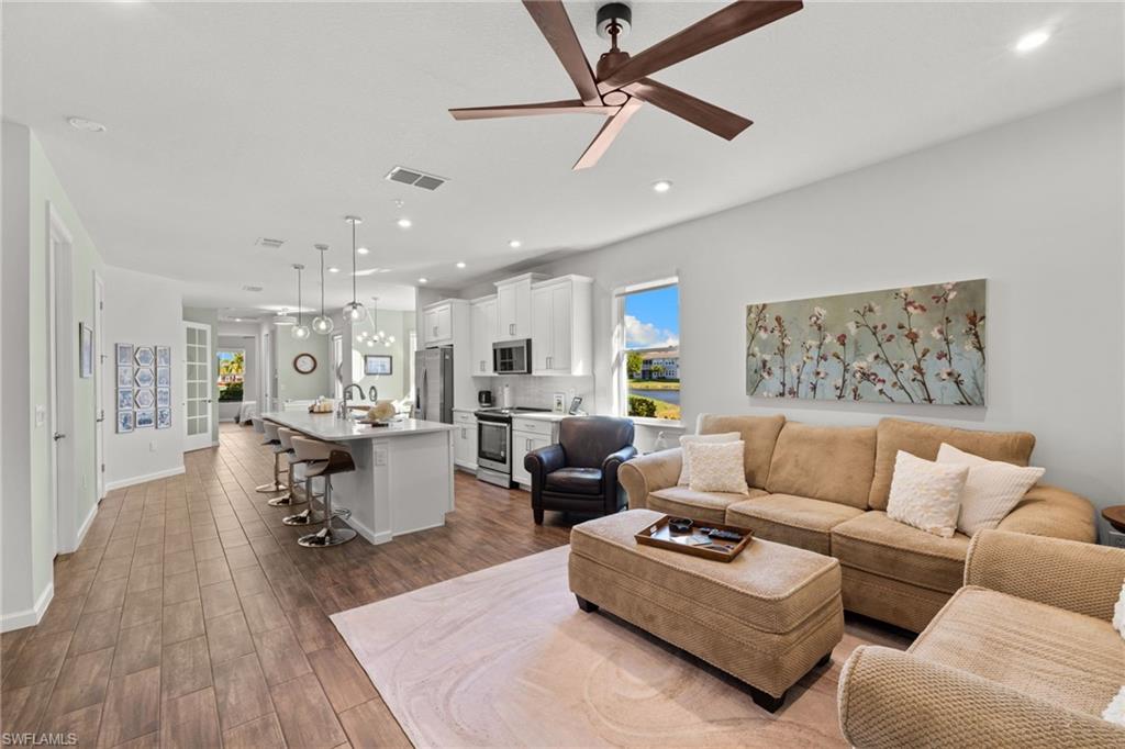 4619 Arboretum Circle, Unit 101 Naples, FL 34112 - Photo 15 of 41 a living room with furniture