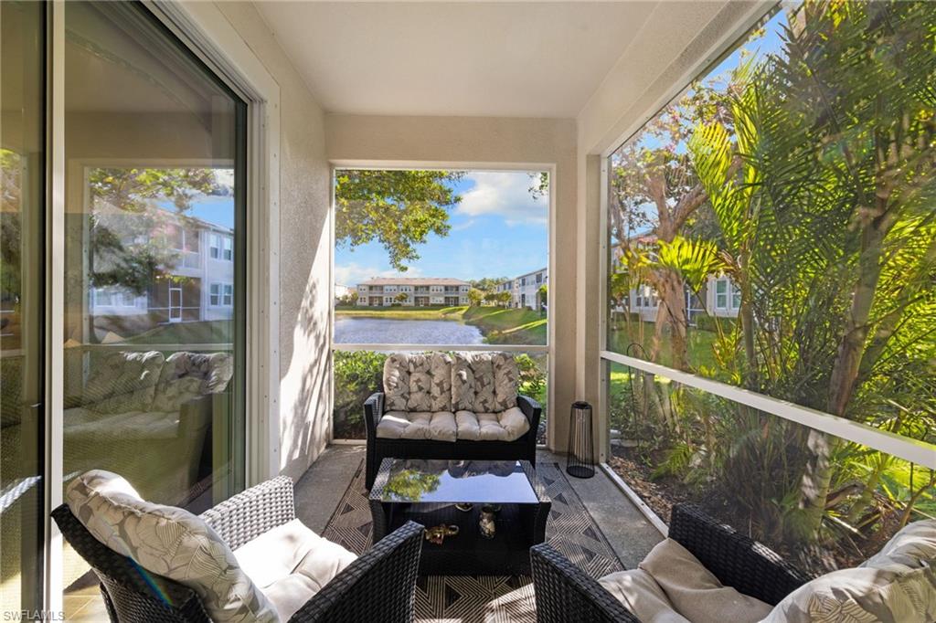 4619 Arboretum Circle, Unit 101 Naples, FL 34112 - Photo 30 of 41 a outdoor living space with furniture