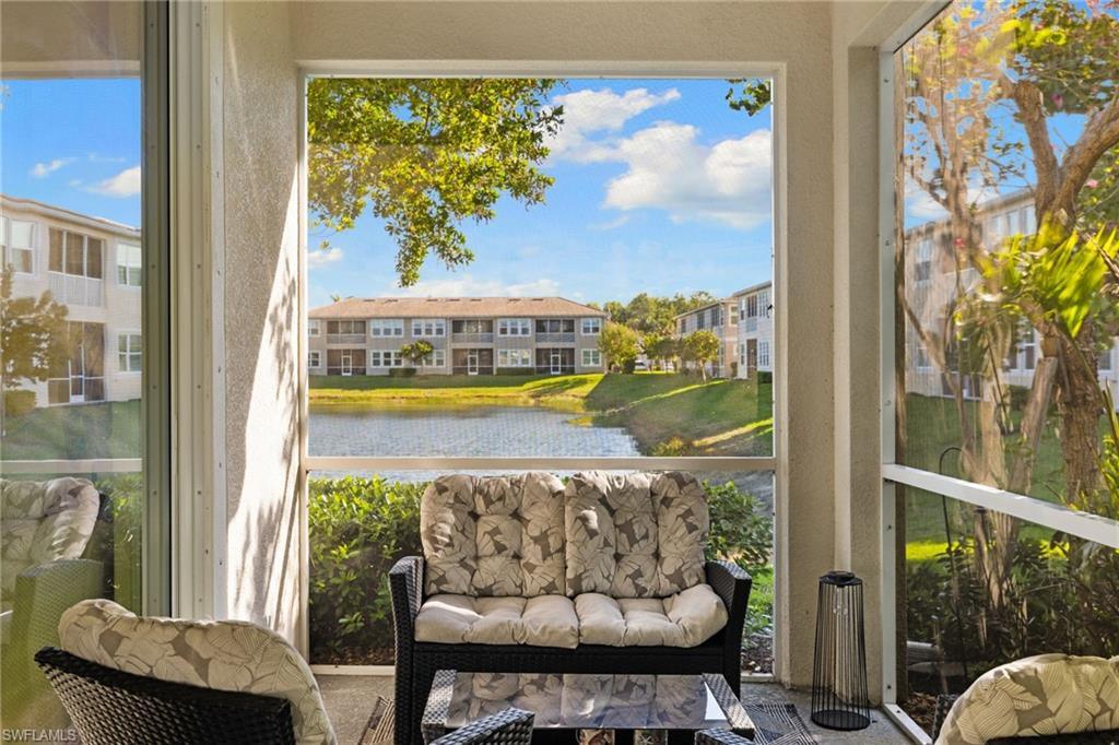 4619 Arboretum Circle, Unit 101 Naples, FL 34112 - Photo 31 of 41 a view of a balcony with chair and a potted plant