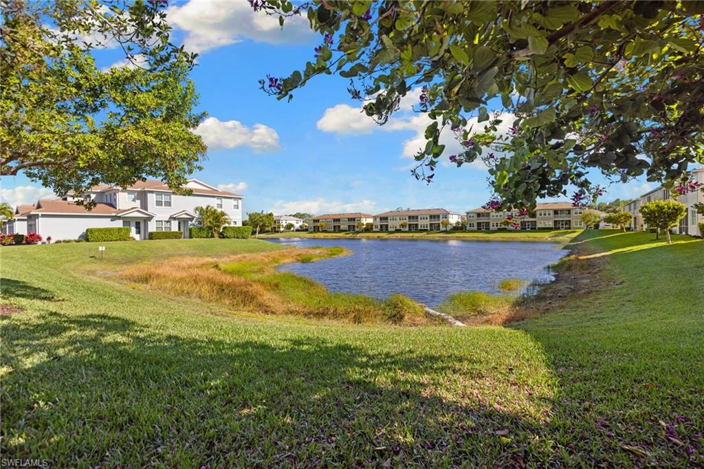 4619 Arboretum Circle, Unit 101 Naples, FL 34112 - Photo 38 of 41 a view of a lake with houses