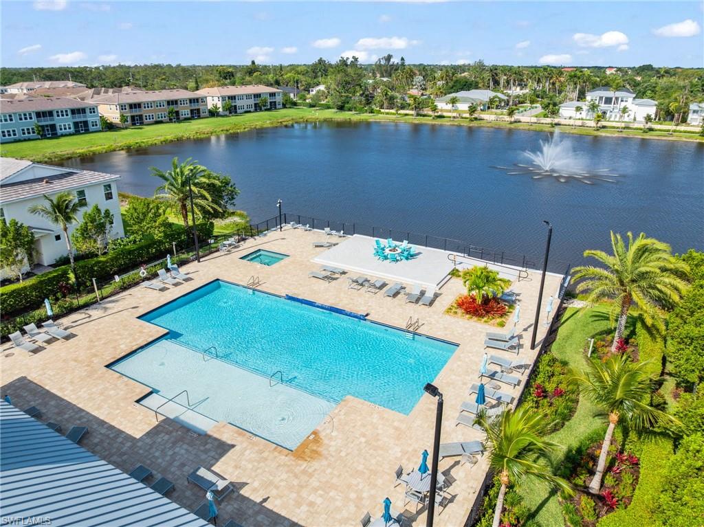 4619 Arboretum Circle, Unit 101 Naples, FL 34112 - Photo 40 of 41 an aerial view of residential houses with outdoor space and lake view