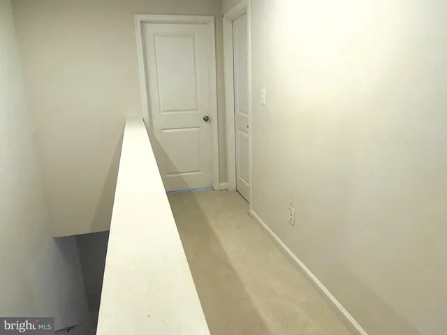 a view of a hallway with shower