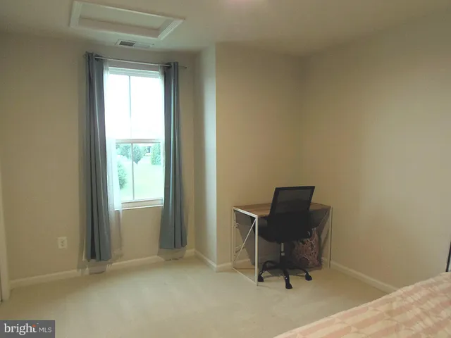 a room that has a chair and a chair in it