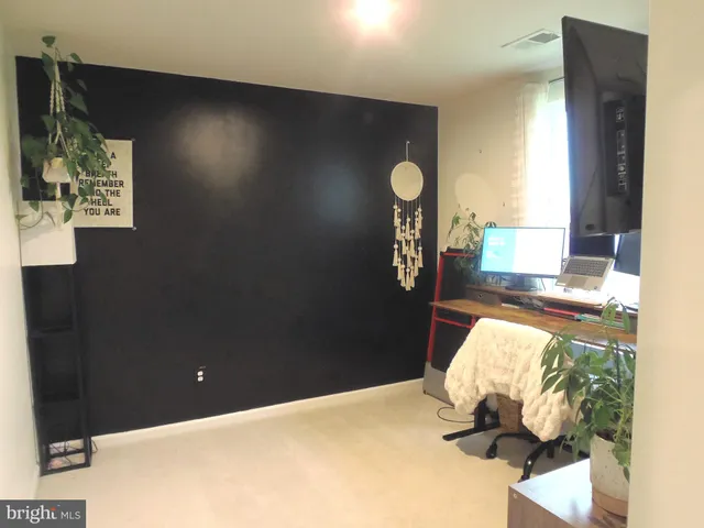 a bedroom with bed and window