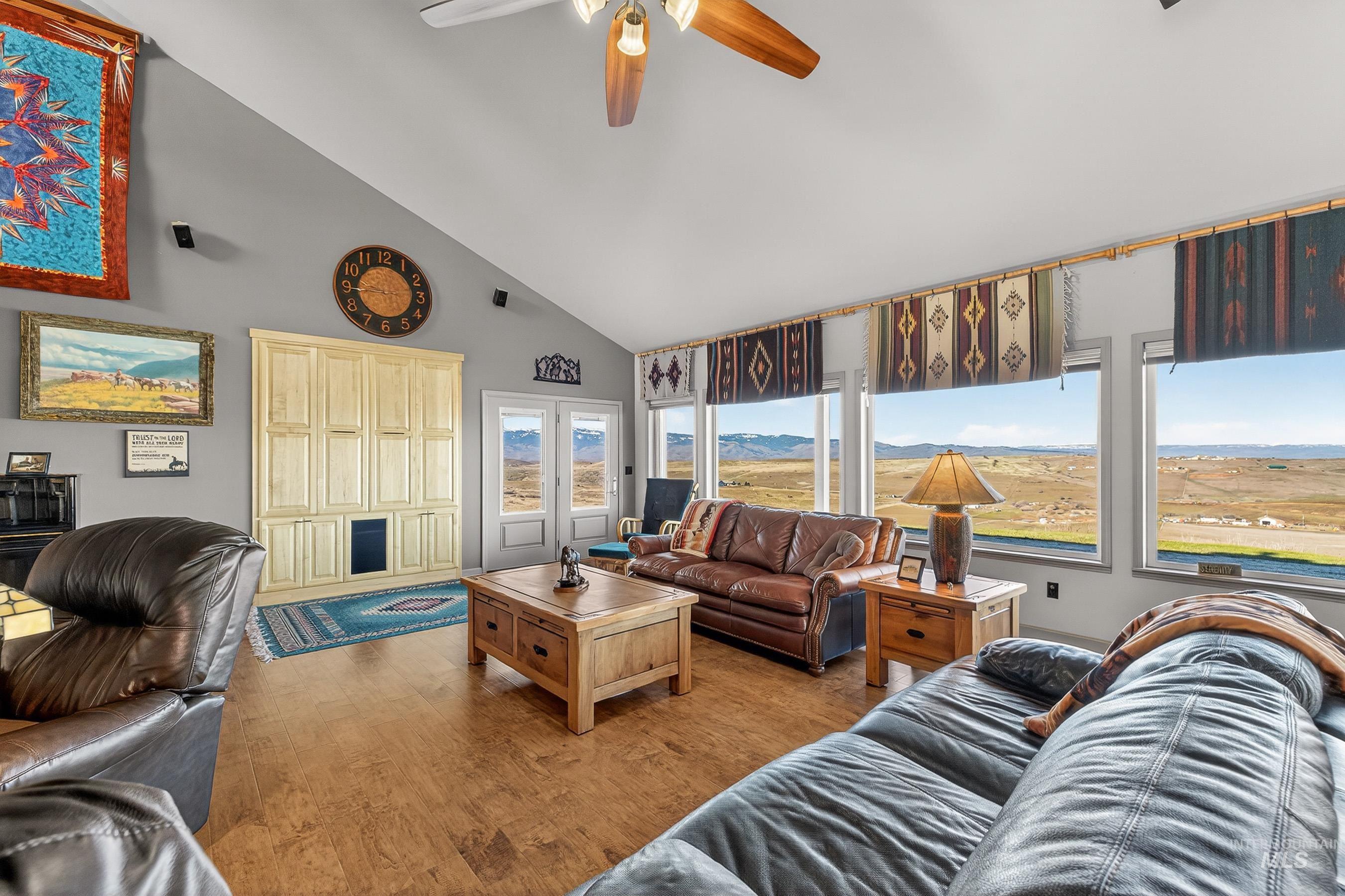 2195 Kilborn Lane Mesa, ID 83643 - Photo 17 of 50 Living area featuring wood finished floors, high vaulted ceiling, and ceiling fan