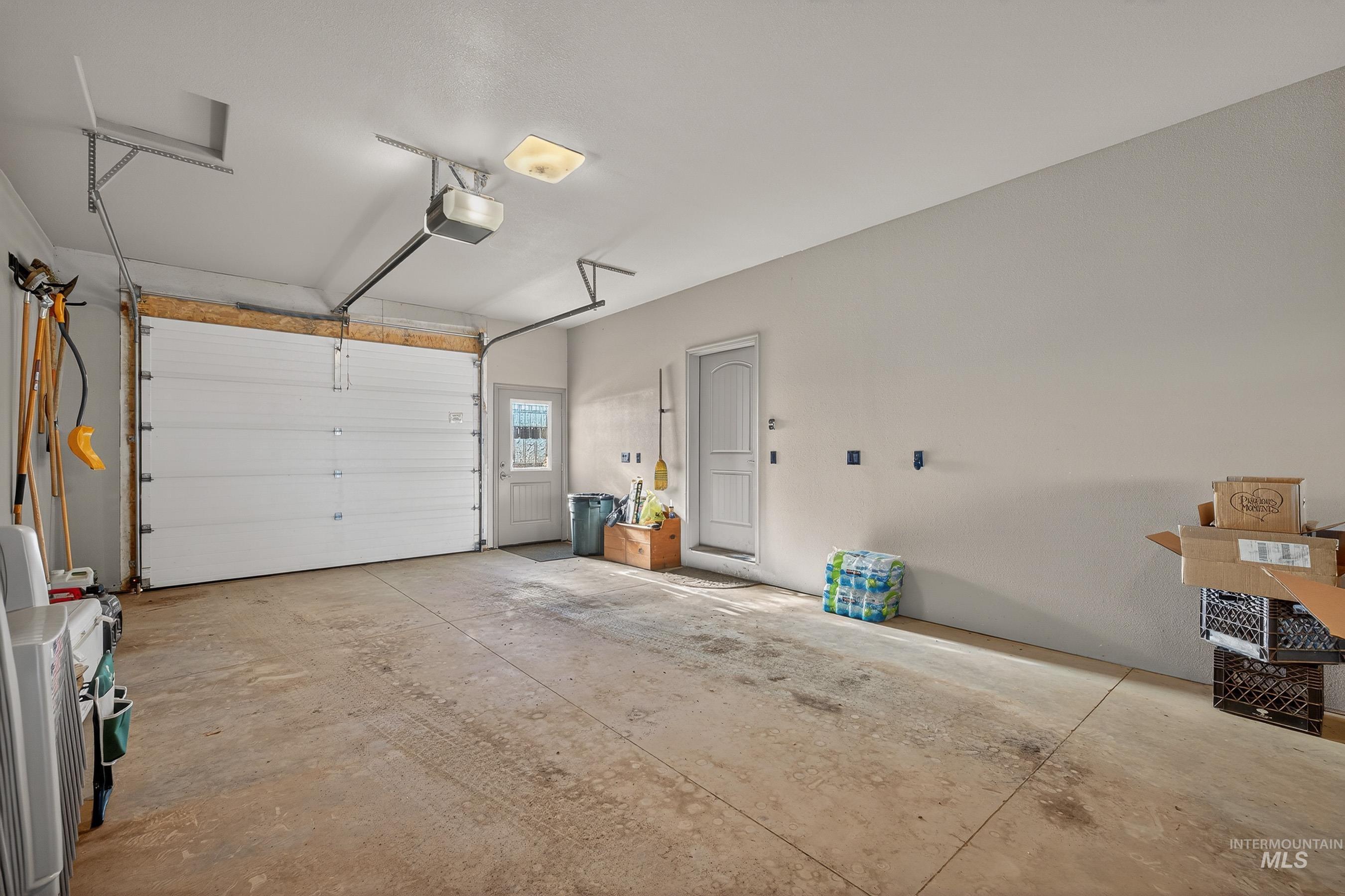 2195 Kilborn Lane Mesa, ID 83643 - Photo 4 of 50 Garage with a garage door opener