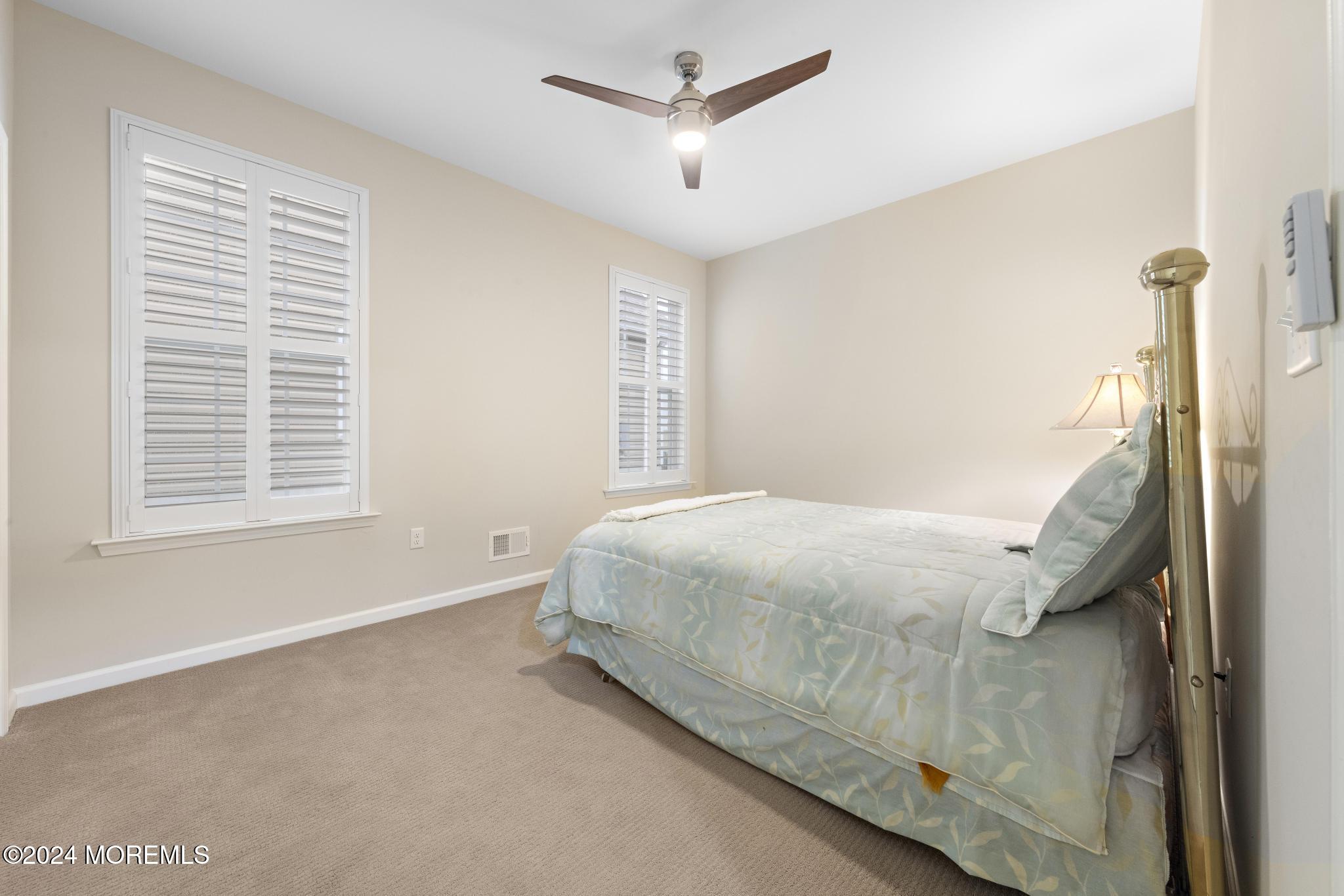 31 Garden Path Barnegat, NJ 08005 - Photo 25 of 54 a bed sitting in a spacious bedroom next to a window