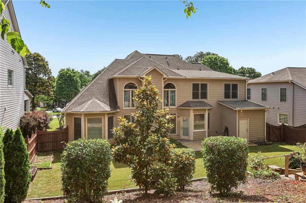 810 Freedom Way Cumming, GA 30040 - Photo 48 of 61 a front view of a house with a yard