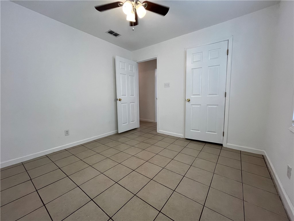 629 Lopez Street Taft, TX 78390 - Photo 16 of 22 an empty room with chandelier fan