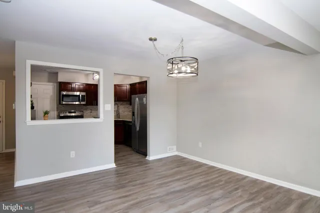 a living room with a fireplace a flat screen tv and a fireplace