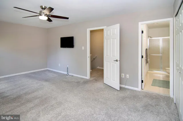a view of a livingroom with an empty space and a flat screen tv